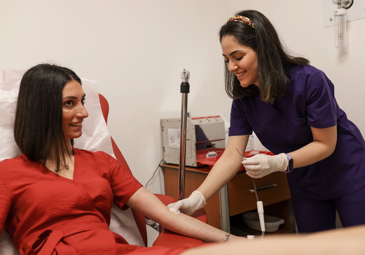 Woman and Nurse During Blood Donation